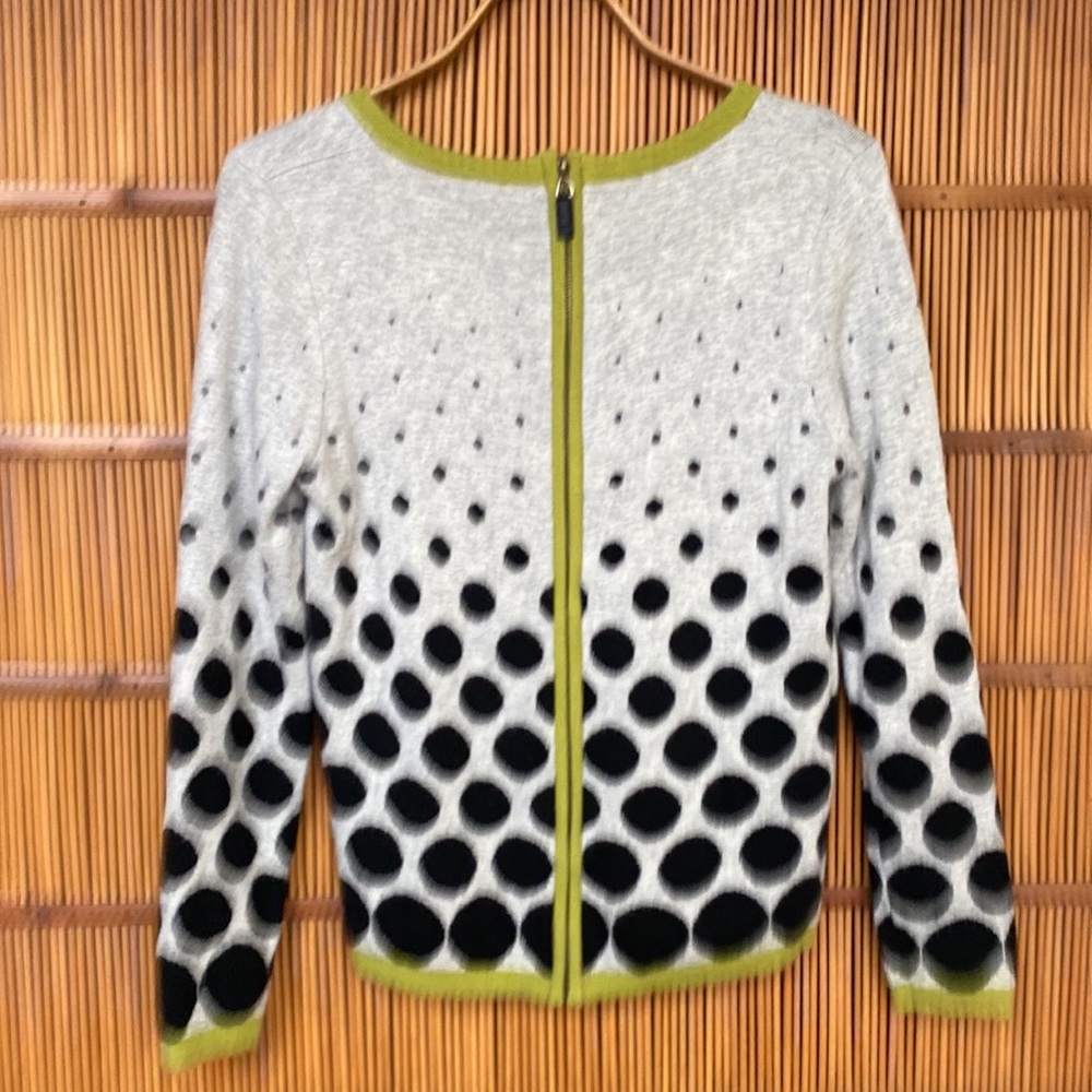 Polka dot woman’s cardigan sweater.